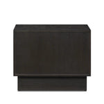 A softened Brutalist take on the traditional nightstand. The monolithic piece’s black oak veneer case sits atop a matching pedestal for an element of exaggeration. A grid pattern with inflated volume adds drama.As enthusiasts of luxe materials at Amethyst, we love the warm modern inspired Swell Nightstand - Dry Black Oak Veneer. Amethyst Home provides interior design, new home construction design consulting, vintage area rugs, and lighting in the Boston metro area.