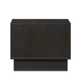 A softened Brutalist take on the traditional nightstand. The monolithic piece’s black oak veneer case sits atop a matching pedestal for an element of exaggeration. A grid pattern with inflated volume adds drama.As enthusiasts of luxe materials at Amethyst, we love the warm modern inspired Swell Nightstand - Dry Black Oak Veneer. Amethyst Home provides interior design, new home construction design consulting, vintage area rugs, and lighting in the Boston metro area.