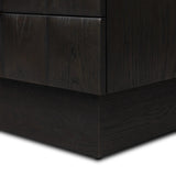 A softened Brutalist take on the traditional nightstand. The monolithic piece’s black oak veneer case sits atop a matching pedestal for an element of exaggeration. A grid pattern with inflated volume adds drama.As enthusiasts of luxe materials at Amethyst, we love the warm modern inspired Swell Nightstand - Dry Black Oak Veneer. Amethyst Home provides interior design, new home construction design consulting, vintage area rugs, and lighting in the Dallas metro area.