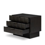 A softened Brutalist take on the traditional nightstand. The monolithic piece’s black oak veneer case sits atop a matching pedestal for an element of exaggeration. A grid pattern with inflated volume adds drama.As enthusiasts of luxe materials at Amethyst, we love the warm modern inspired Swell Nightstand - Dry Black Oak Veneer. Amethyst Home provides interior design, new home construction design consulting, vintage area rugs, and lighting in the Nashville metro area.