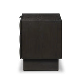 A softened Brutalist take on the traditional nightstand. The monolithic piece’s black oak veneer case sits atop a matching pedestal for an element of exaggeration. A grid pattern with inflated volume adds drama.As enthusiasts of luxe materials at Amethyst, we love the warm modern inspired Swell Nightstand - Dry Black Oak Veneer. Amethyst Home provides interior design, new home construction design consulting, vintage area rugs, and lighting in the Newport Beach metro area.