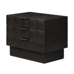 A softened Brutalist take on the traditional nightstand. The monolithic piece’s black oak veneer case sits atop a matching pedestal for an element of exaggeration. A grid pattern with inflated volume adds drama.As enthusiasts of luxe materials at Amethyst, we love the warm modern inspired Swell Nightstand - Dry Black Oak Veneer. Amethyst Home provides interior design, new home construction design consulting, vintage area rugs, and lighting in the Omaha metro area.