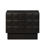 A softened Brutalist take on the traditional nightstand. The monolithic piece’s black oak veneer case sits atop a matching pedestal for an element of exaggeration. A grid pattern with inflated volume adds drama.As enthusiasts of luxe materials at Amethyst, we love the warm modern inspired Swell Nightstand - Dry Black Oak Veneer. Amethyst Home provides interior design, new home construction design consulting, vintage area rugs, and lighting in the Scottsdale metro area.