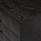 A softened Brutalist take on the traditional nightstand. The monolithic piece’s black oak veneer case sits atop a matching pedestal for an element of exaggeration. A grid pattern with inflated volume adds drama.As enthusiasts of luxe materials at Amethyst, we love the warm modern inspired Swell Nightstand - Dry Black Oak Veneer. Amethyst Home provides interior design, new home construction design consulting, vintage area rugs, and lighting in the Seattle metro area.