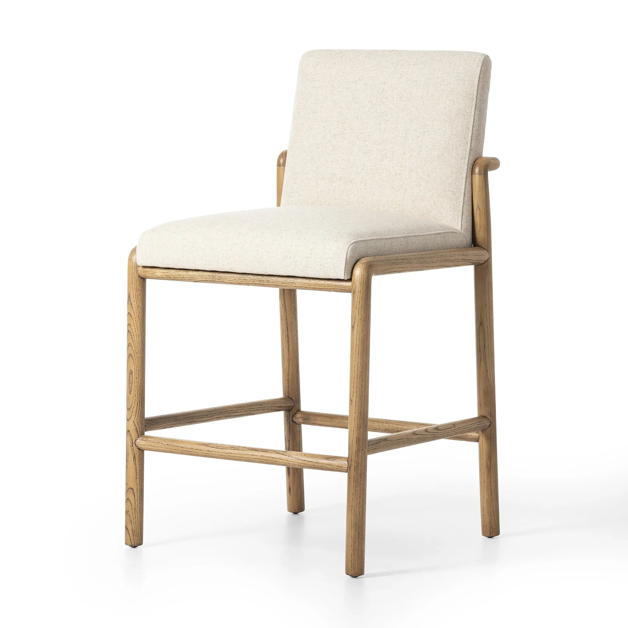 A fluid nettlewood frame cradles a comfortable cushion in a high-performance linen blend. At the back of the chair, a fabric covered handle adds architectural interest to a seamless form. Perfectly sized for the counter. Amethyst Home provides interior design, new home construction design consulting, vintage area rugs, and lighting in the Laguna Beach metro area.
