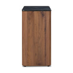 Design your space with hallmark features inspired by soft Brutalism. Made from solid walnut and poplar woods with a natural finish, the cabinet is topped with a black marble top with half bullnose edging for smooth contours. Double doors open to two shelves for ample storage. High-quality hardware is crafted from black iron. Amethyst Home provides interior design, new home construction design consulting, vintage area rugs, and lighting in the Boston metro area.