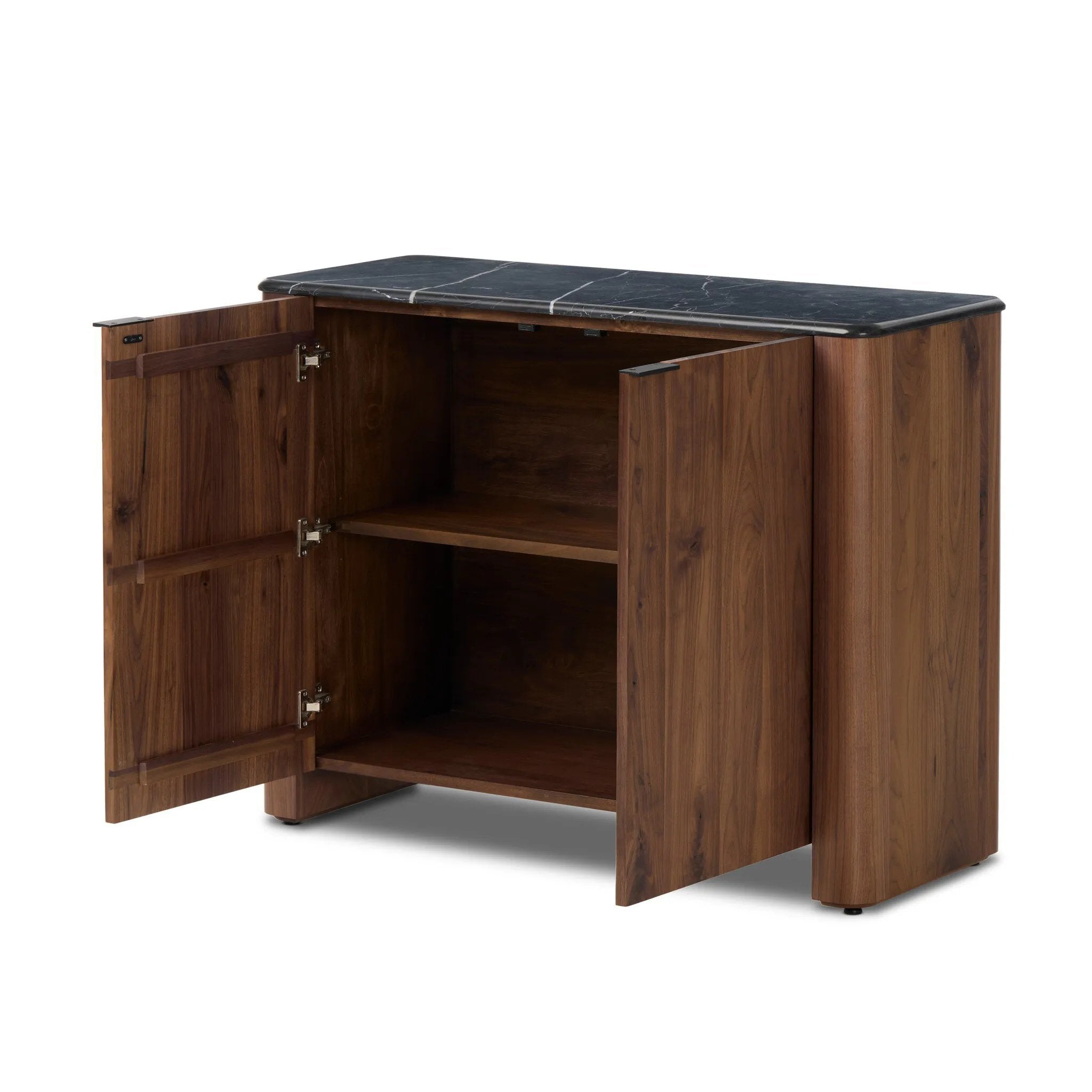Design your space with hallmark features inspired by soft Brutalism. Made from solid walnut and poplar woods with a natural finish, the cabinet is topped with a black marble top with half bullnose edging for smooth contours. Double doors open to two shelves for ample storage. High-quality hardware is crafted from black iron. Amethyst Home provides interior design, new home construction design consulting, vintage area rugs, and lighting in the Miami metro area.