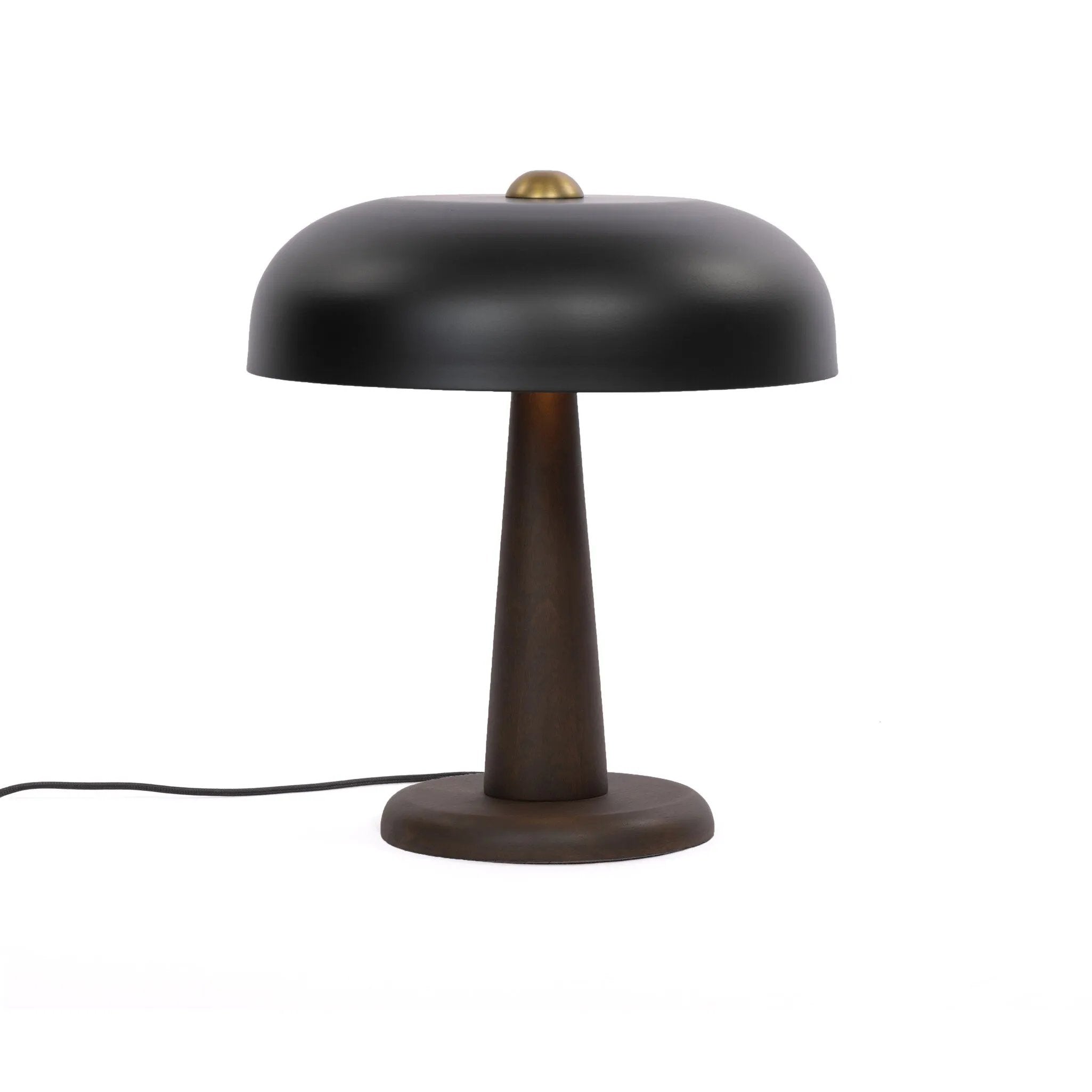 Featuring Tennon Russet Mango Table Lamp by Four Hands at Amethyst Home. This Seventies-inspired table lamp combines a low, curved metal shade with a classic brass finial and wooden base. Perfect in a home office or on your nightstand as a bedside reading lamp. Overall Dimensions: 14.00"w x 14.00"d x 16.00"h. Amethyst Home provides interior design, new home construction design consulting, vintage area rugs, and lighting in the Newport Beach metro area.