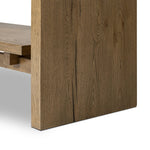 Wide and stately, with plenty of space for storage and display. A bookcase made from rustic amber-finished oak shapes a wide floating shelf design, with layered cross supports bringing an architectural feel to the office or living room Amethyst Home provides interior design, new home construction design consulting, vintage area rugs, and lighting in the Portland metro area.