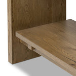 Wide and stately, with plenty of space for storage and display. A bookcase made from rustic amber-finished oak shapes a wide floating shelf design, with layered cross supports bringing an architectural feel to the office or living room Amethyst Home provides interior design, new home construction design consulting, vintage area rugs, and lighting in the San Diego metro area.