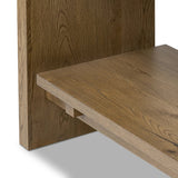 Wide and stately, with plenty of space for storage and display. A bookcase made from rustic amber-finished oak shapes a wide floating shelf design, with layered cross supports bringing an architectural feel to the office or living room Amethyst Home provides interior design, new home construction design consulting, vintage area rugs, and lighting in the San Diego metro area.