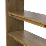 Wide and stately, with plenty of space for storage and display. A bookcase made from rustic amber-finished oak shapes a wide floating shelf design, with layered cross supports bringing an architectural feel to the office or living room Amethyst Home provides interior design, new home construction design consulting, vintage area rugs, and lighting in the Washington metro area.