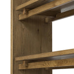 Wide and stately, with plenty of space for storage and display. A bookcase made from rustic amber-finished oak shapes a wide floating shelf design, with layered cross supports bringing an architectural feel to the office or living room Amethyst Home provides interior design, new home construction design consulting, vintage area rugs, and lighting in the Winter Garden metro area.