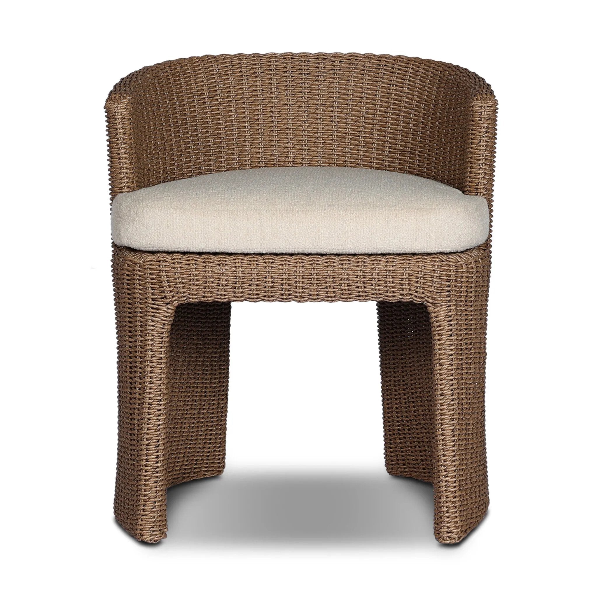 This outdoor dining chair takes on a curved silhouette, crafted from woven faux hyacinth and complemented by a heavily textured boucle cushion. Cover or store inside during inclement weather and when not in use.As lovers of natural materials at Amethyst, we love the designer inspired Thora Outdoor Dining Chair - Vada Cream. Amethyst Home provides interior design, new home construction design consulting, vintage area rugs, and lighting in the Tampa metro area.