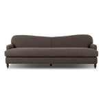The traditional English roll-arm sofa gains refinement. Clean lines replace the fuss, retaining nothing but pure, effortless comfort. The sofa features a graceful reverse camelback and back-turned wooden legs, balanced by pleated arms and an exaggerated, voluminous seat cushion. Generously filled with feathers for added texture and character. Amethyst Home provides interior design, new home construction design consulting, vintage area rugs, and lighting in the Boston metro area.