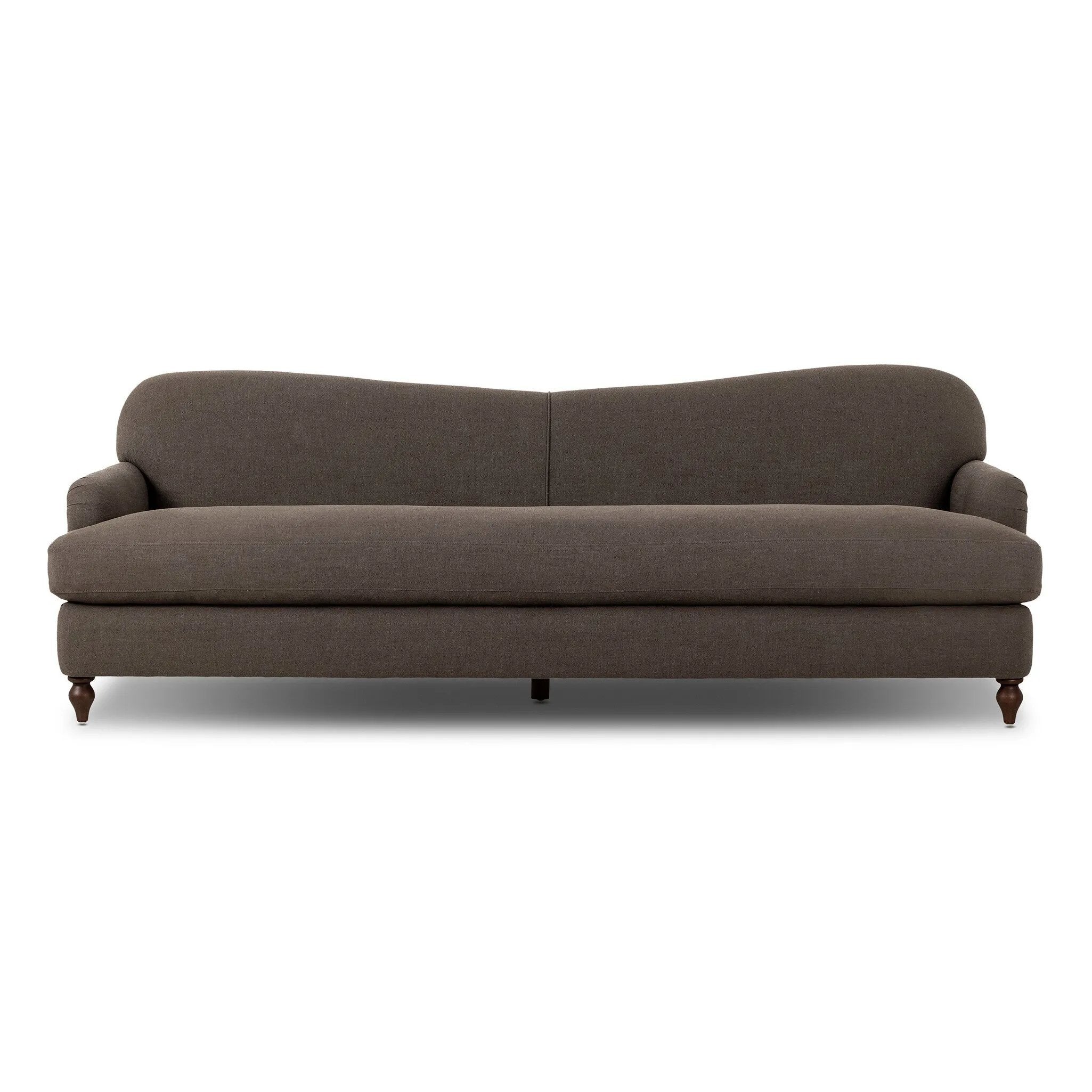 The traditional English roll-arm sofa gains refinement. Clean lines replace the fuss, retaining nothing but pure, effortless comfort. The sofa features a graceful reverse camelback and back-turned wooden legs, balanced by pleated arms and an exaggerated, voluminous seat cushion. Generously filled with feathers for added texture and character. Amethyst Home provides interior design, new home construction design consulting, vintage area rugs, and lighting in the Boston metro area.