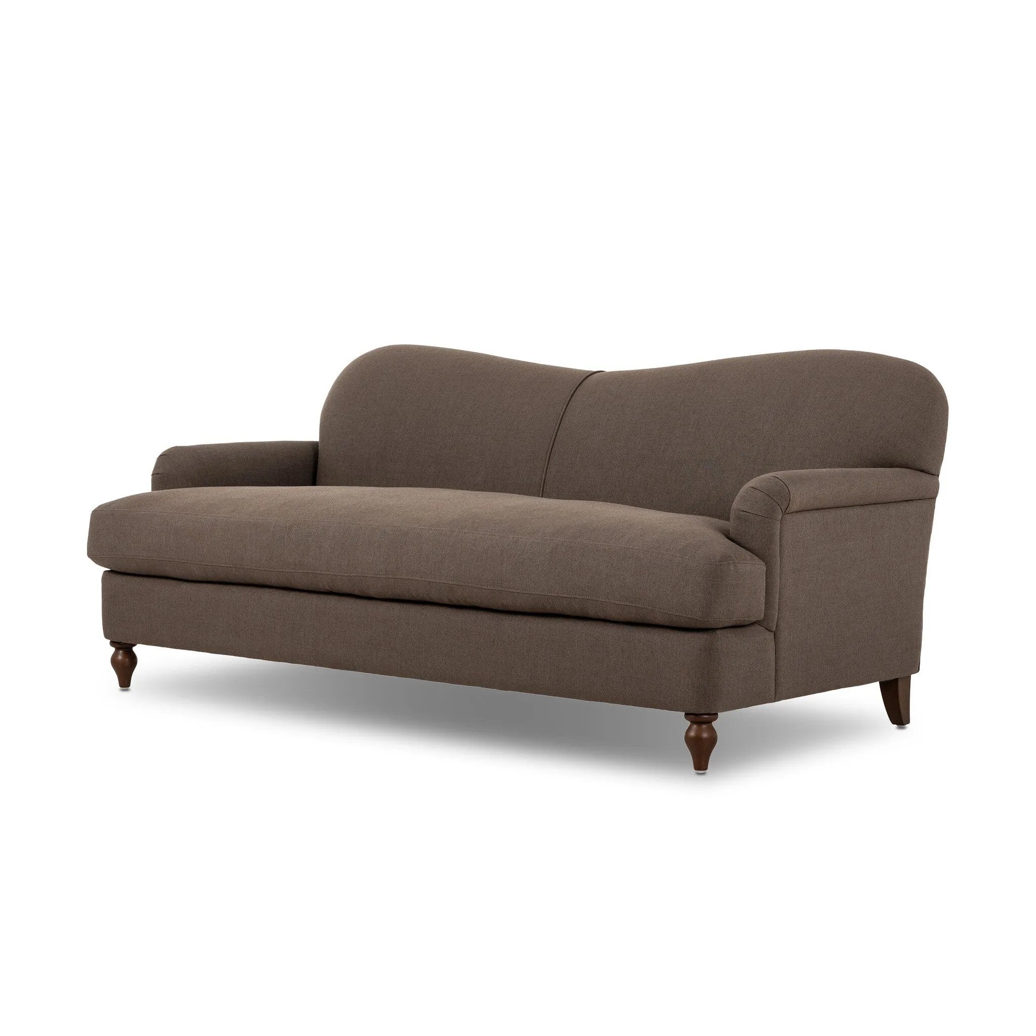 The traditional English roll-arm sofa gains refinement. Clean lines replace the fuss, retaining nothing but pure, effortless comfort. The sofa features a graceful reverse camelback and back-turned wooden legs, balanced by pleated arms and an exaggerated, voluminous seat cushion. Generously filled with feathers for added texture and character. Amethyst Home provides interior design, new home construction design consulting, vintage area rugs, and lighting in the Miami metro area.