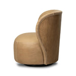 Great for smaller spaces or a reading nook, this petite slipper chair is wrapped in top-grain leather and backed with textured wood that folds into wings, cradling the head and shoulders for a little extra support. Features a 360-degree swivel base. Amethyst Home provides interior design, new home construction design consulting, vintage area rugs, and lighting in the San Diego metro area.