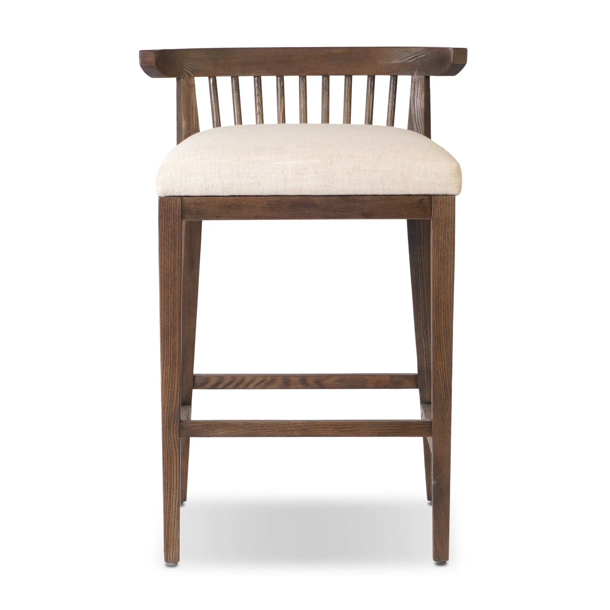 A low, linear counter stool inspired by Japanese tea houses, crafted from natural ash. Designed for comfort, a thick cushion seat is upholstered in a casual poly-linen blend Amethyst Home provides interior design, new home construction design consulting, vintage area rugs, and lighting in the Austin metro area.