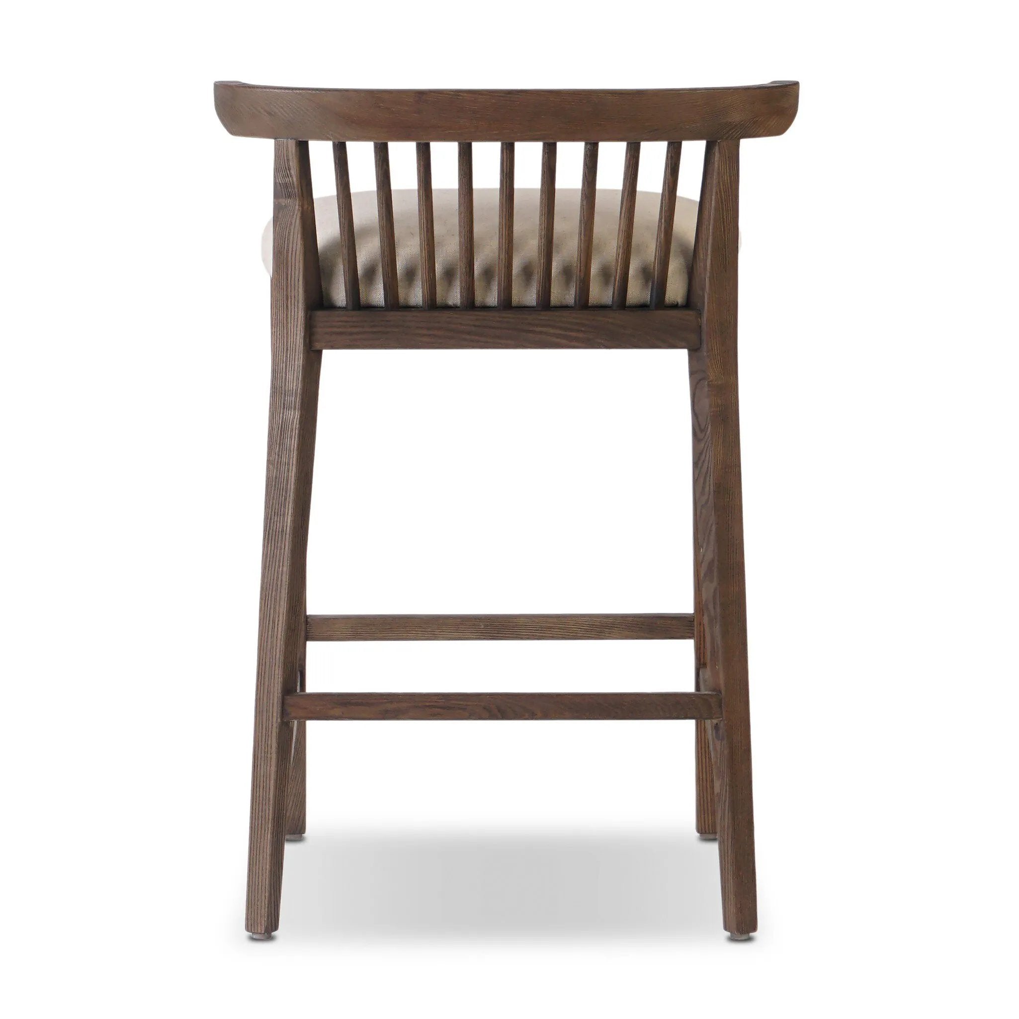 A low, linear counter stool inspired by Japanese tea houses, crafted from natural ash. Designed for comfort, a thick cushion seat is upholstered in a casual poly-linen blend Amethyst Home provides interior design, new home construction design consulting, vintage area rugs, and lighting in the Newport Beach metro area.