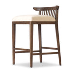 A low, linear counter stool inspired by Japanese tea houses, crafted from natural ash. Designed for comfort, a thick cushion seat is upholstered in a casual poly-linen blend Amethyst Home provides interior design, new home construction design consulting, vintage area rugs, and lighting in the Tampa metro area.