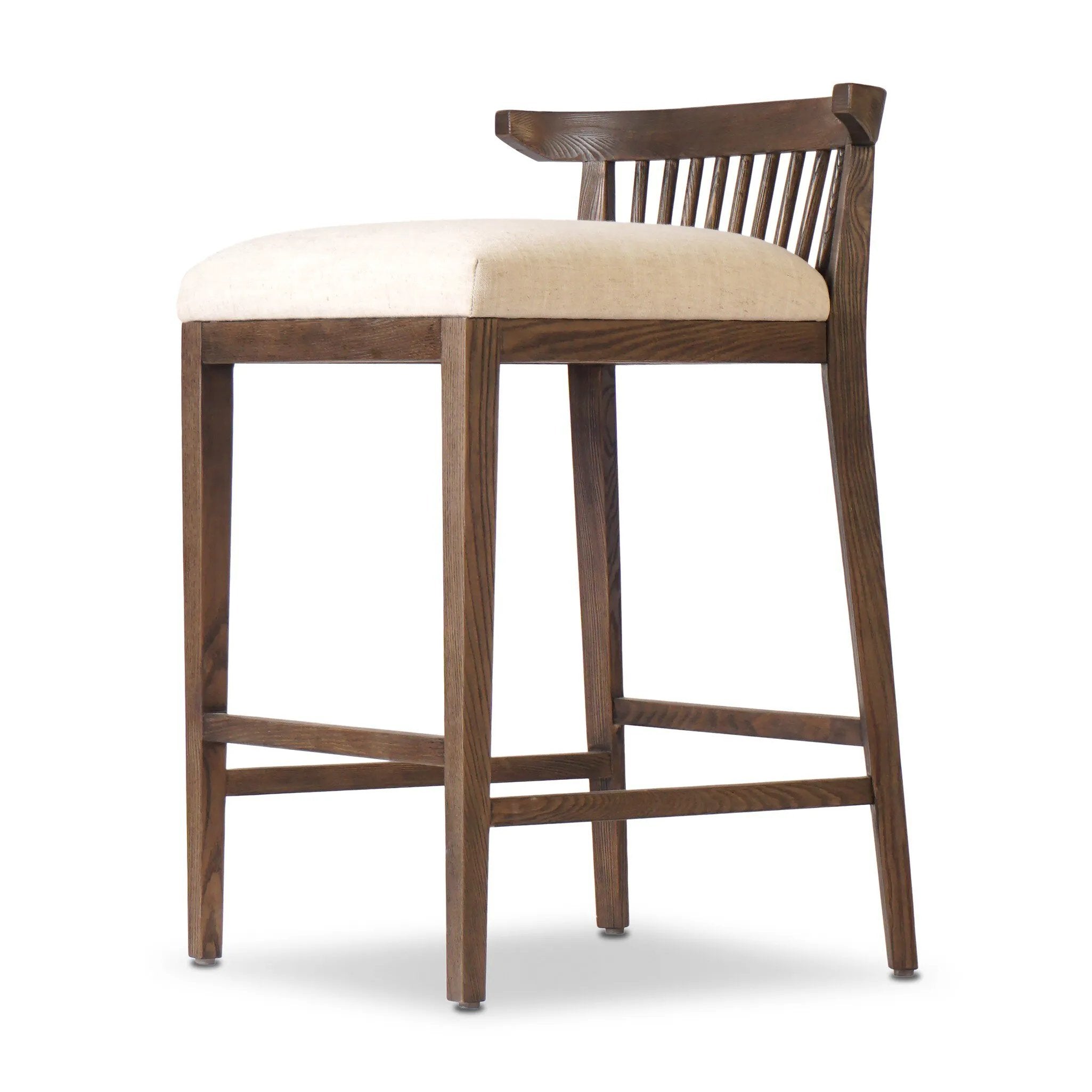 A low, linear counter stool inspired by Japanese tea houses, crafted from natural ash. Designed for comfort, a thick cushion seat is upholstered in a casual poly-linen blend Amethyst Home provides interior design, new home construction design consulting, vintage area rugs, and lighting in the Tampa metro area.