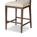 A low, linear counter stool inspired by Japanese tea houses, crafted from natural ash. Designed for comfort, a thick cushion seat is upholstered in a casual poly-linen blend Amethyst Home provides interior design, new home construction design consulting, vintage area rugs, and lighting in the Washington metro area.
