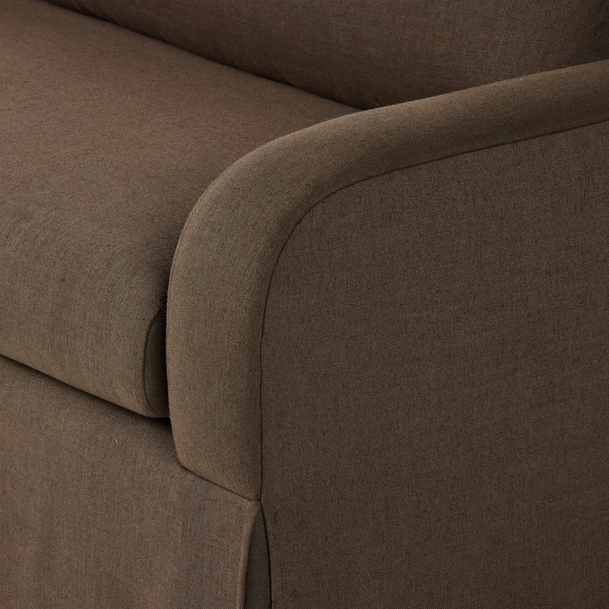 Meet the piece that can do it all. Coffee-colored fabric covers a long bench-style seat, while a concealed sleeper mechanism allows for easy pullout to transform this flexible piece into an extra bed. Curved slope arms finish into a fixed slipcover with kick-pleats at the front. Amethyst Home provides interior design, new home construction design consulting, vintage area rugs, and lighting in the Boston metro area.