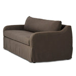 Meet the piece that can do it all. Coffee-colored fabric covers a long bench-style seat, while a concealed sleeper mechanism allows for easy pullout to transform this flexible piece into an extra bed. Curved slope arms finish into a fixed slipcover with kick-pleats at the front. Amethyst Home provides interior design, new home construction design consulting, vintage area rugs, and lighting in the Calabasas metro area.