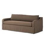 Meet the piece that can do it all. Coffee-colored fabric covers a long bench-style seat, while a concealed sleeper mechanism allows for easy pullout to transform this flexible piece into an extra bed. Curved slope arms finish into a fixed slipcover with kick-pleats at the front. Amethyst Home provides interior design, new home construction design consulting, vintage area rugs, and lighting in the Laguna Beach metro area.