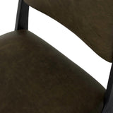 A metal frame with a tapered profile pairs with a moss-colored top-grain leather seat and back, striking balance in both scale in texture.As fans of wabi sabi aesthetics at Amethyst, we love the optimistic inspired Valeene Dining Chair - Dulane Moss. This item pairs well with other brands such as Surya and is perfect for minimalist homes Amethyst Home provides interior design, new home construction design consulting, vintage area rugs, and lighting in the Calabasas metro area.