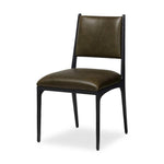 A metal frame with a tapered profile pairs with a moss-colored top-grain leather seat and back, striking balance in both scale in texture.As fans of wabi sabi aesthetics at Amethyst, we love the optimistic inspired Valeene Dining Chair - Dulane Moss. This item pairs well with other brands such as Surya and is perfect for minimalist homes Amethyst Home provides interior design, new home construction design consulting, vintage area rugs, and lighting in the Tampa metro area.