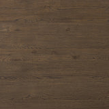 Made from rustic brown oak, a rectangular coffee table is streamlined while not short on presence, with its exaggerated cylinder legs and polished pill-shaped top Amethyst Home provides interior design, new home construction design consulting, vintage area rugs, and lighting in the Austin metro area.