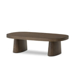 Made from rustic brown oak, a rectangular coffee table is streamlined while not short on presence, with its exaggerated cylinder legs and polished pill-shaped top Amethyst Home provides interior design, new home construction design consulting, vintage area rugs, and lighting in the Boston metro area.