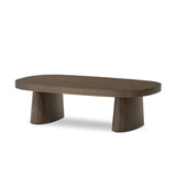 Made from rustic brown oak, a rectangular coffee table is streamlined while not short on presence, with its exaggerated cylinder legs and polished pill-shaped top Amethyst Home provides interior design, new home construction design consulting, vintage area rugs, and lighting in the Boston metro area.