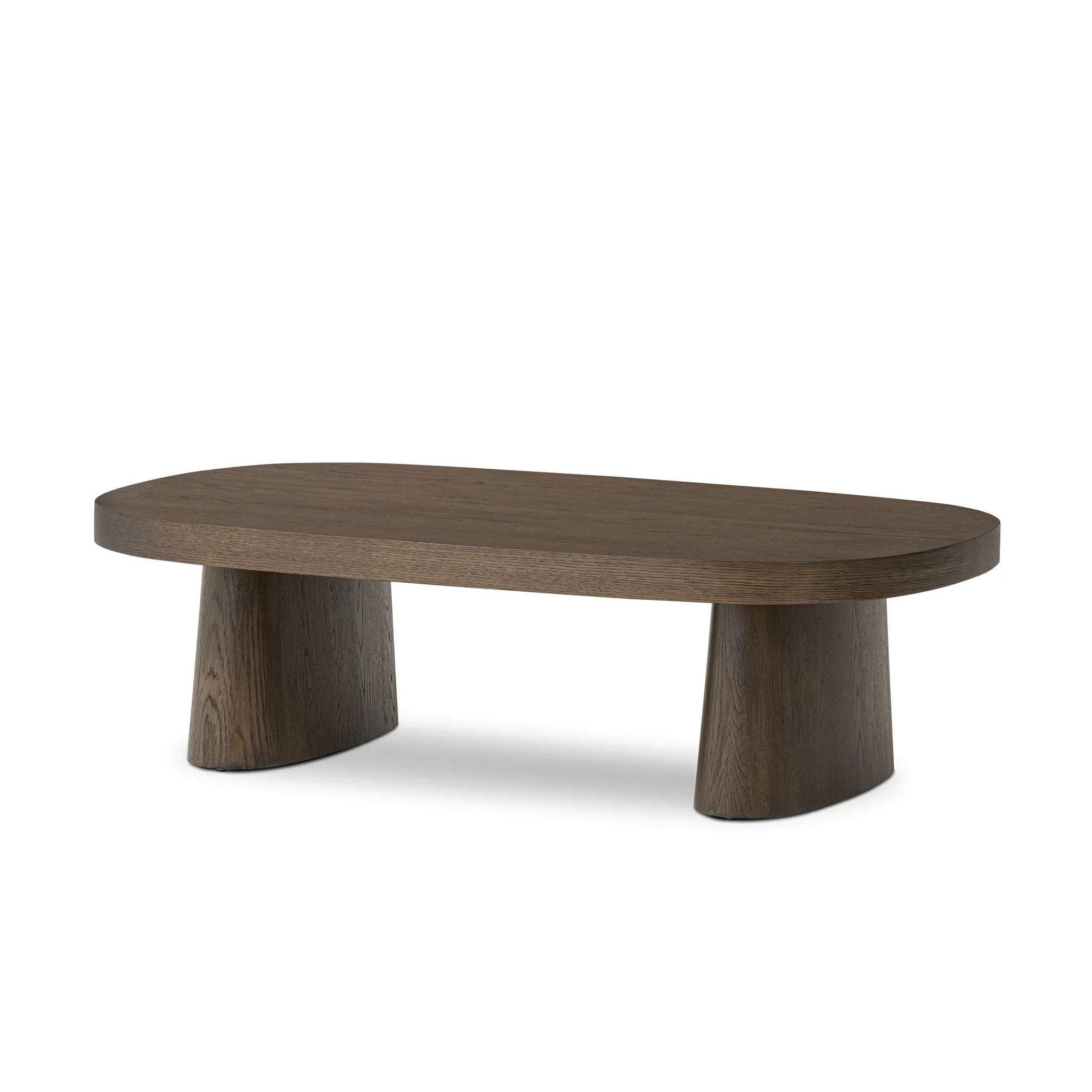Made from rustic brown oak, a rectangular coffee table is streamlined while not short on presence, with its exaggerated cylinder legs and polished pill-shaped top Amethyst Home provides interior design, new home construction design consulting, vintage area rugs, and lighting in the Boston metro area.