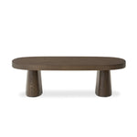 Made from rustic brown oak, a rectangular coffee table is streamlined while not short on presence, with its exaggerated cylinder legs and polished pill-shaped top Amethyst Home provides interior design, new home construction design consulting, vintage area rugs, and lighting in the Los Angeles metro area.