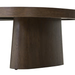 Made from rustic brown oak, a rectangular coffee table is streamlined while not short on presence, with its exaggerated cylinder legs and polished pill-shaped top Amethyst Home provides interior design, new home construction design consulting, vintage area rugs, and lighting in the Newport Beach metro area.