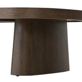 Made from rustic brown oak, a rectangular coffee table is streamlined while not short on presence, with its exaggerated cylinder legs and polished pill-shaped top Amethyst Home provides interior design, new home construction design consulting, vintage area rugs, and lighting in the Newport Beach metro area.