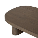 Made from rustic brown oak, a rectangular coffee table is streamlined while not short on presence, with its exaggerated cylinder legs and polished pill-shaped top Amethyst Home provides interior design, new home construction design consulting, vintage area rugs, and lighting in the Winter Garden metro area.
