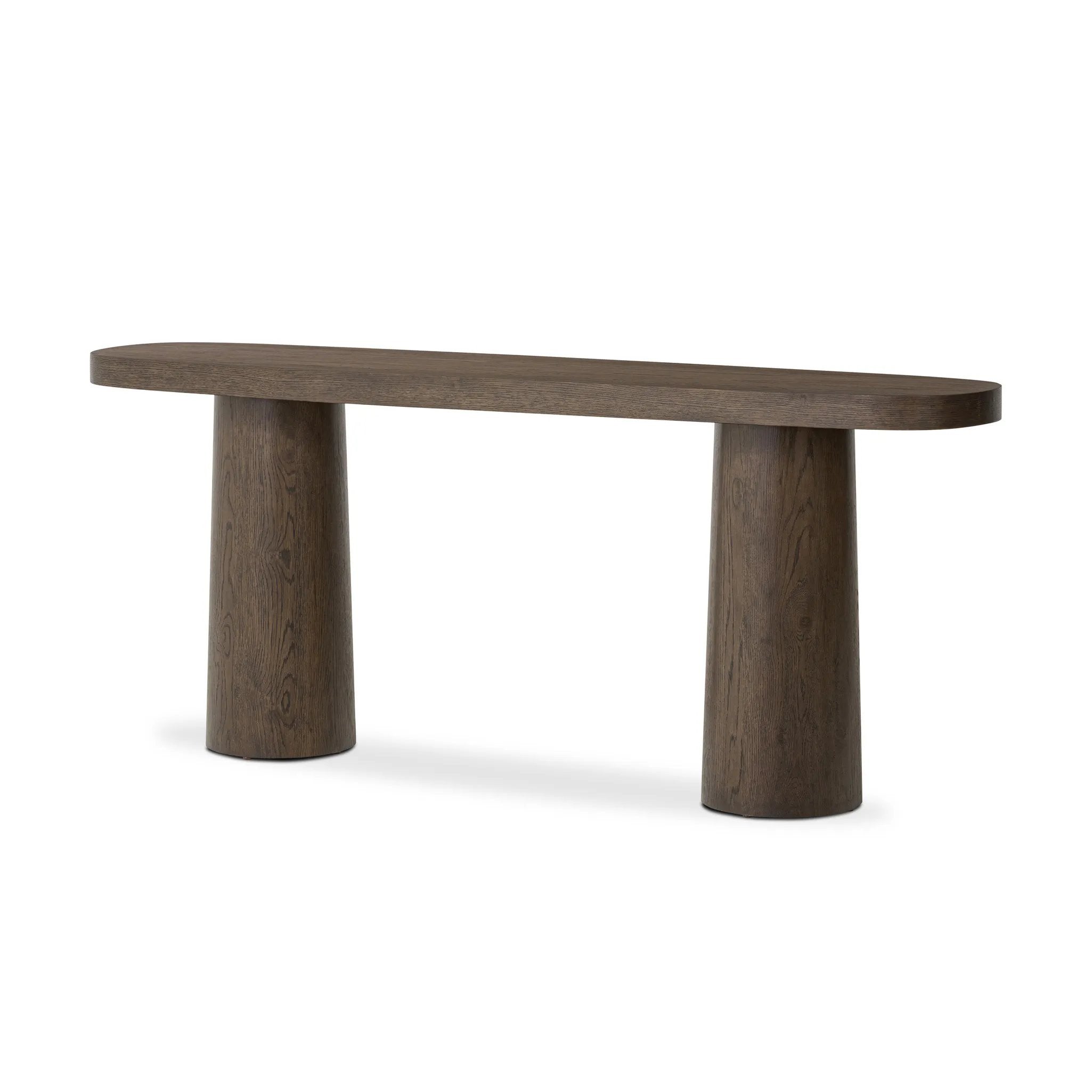 Made from rustic brown oak, an open-style console table is streamlined while not short on presence, with its exaggerated cylinder legs and polished pill-shaped top Amethyst Home provides interior design, new home construction design consulting, vintage area rugs, and lighting in the Salt Lake City metro area.