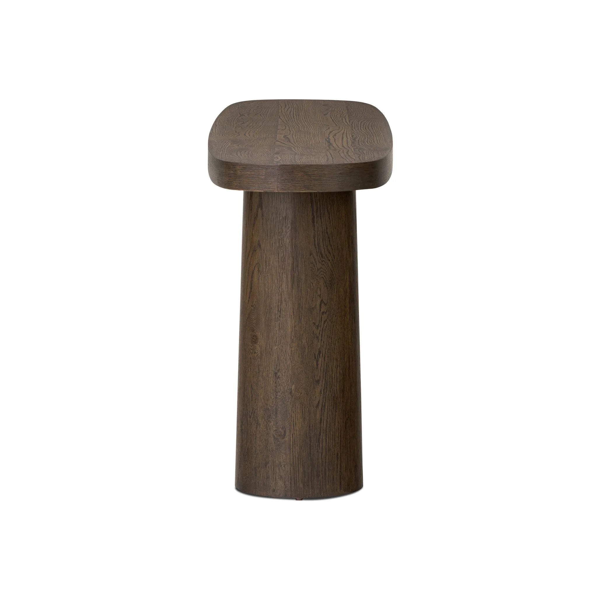 Featuring Valen Rustic Brown Oak Veneer Console Table by Four Hands at Amethyst Home. Made from rustic brown oak, an open-style console table is streamlined while not short on presence, with its exaggerated cylinder legs and polished pill-shaped top.Overall Dimensions: 78.00"w x 18.00"d x 32.00"hWeight : 99.21 lbsMaterials: Oak Veneer, Oak Plywood. Amethyst Home provides interior design, new home construction design consulting, vintage area rugs, and lighting in the Seattle metro area.