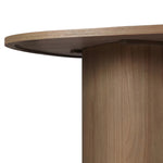 Center your dining space with a beautifully simple style inspired by soft Brutalism. Made from solid mindi with a light, sandy finish, this monolithic piece features a unique "squircle" tabletop, with flowing curves on its edges. A substantial plinth base is rotated to a 45-degree angle to highlight this piece's playful shaping Amethyst Home provides interior design, new home construction design consulting, vintage area rugs, and lighting in the Calabasas metro area.