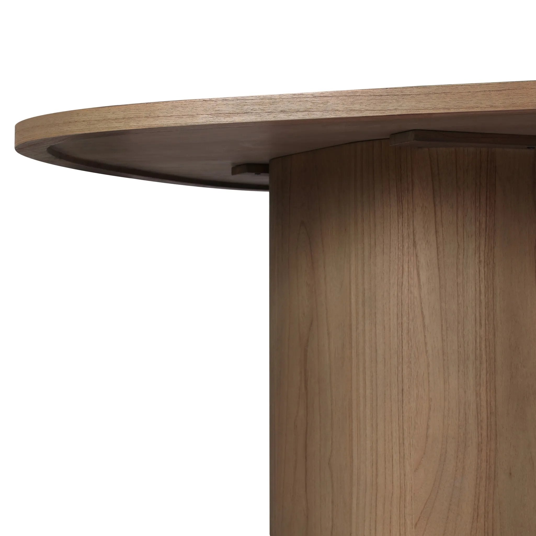 Center your dining space with a beautifully simple style inspired by soft Brutalism. Made from solid mindi with a light, sandy finish, this monolithic piece features a unique "squircle" tabletop, with flowing curves on its edges. A substantial plinth base is rotated to a 45-degree angle to highlight this piece's playful shaping Amethyst Home provides interior design, new home construction design consulting, vintage area rugs, and lighting in the Calabasas metro area.