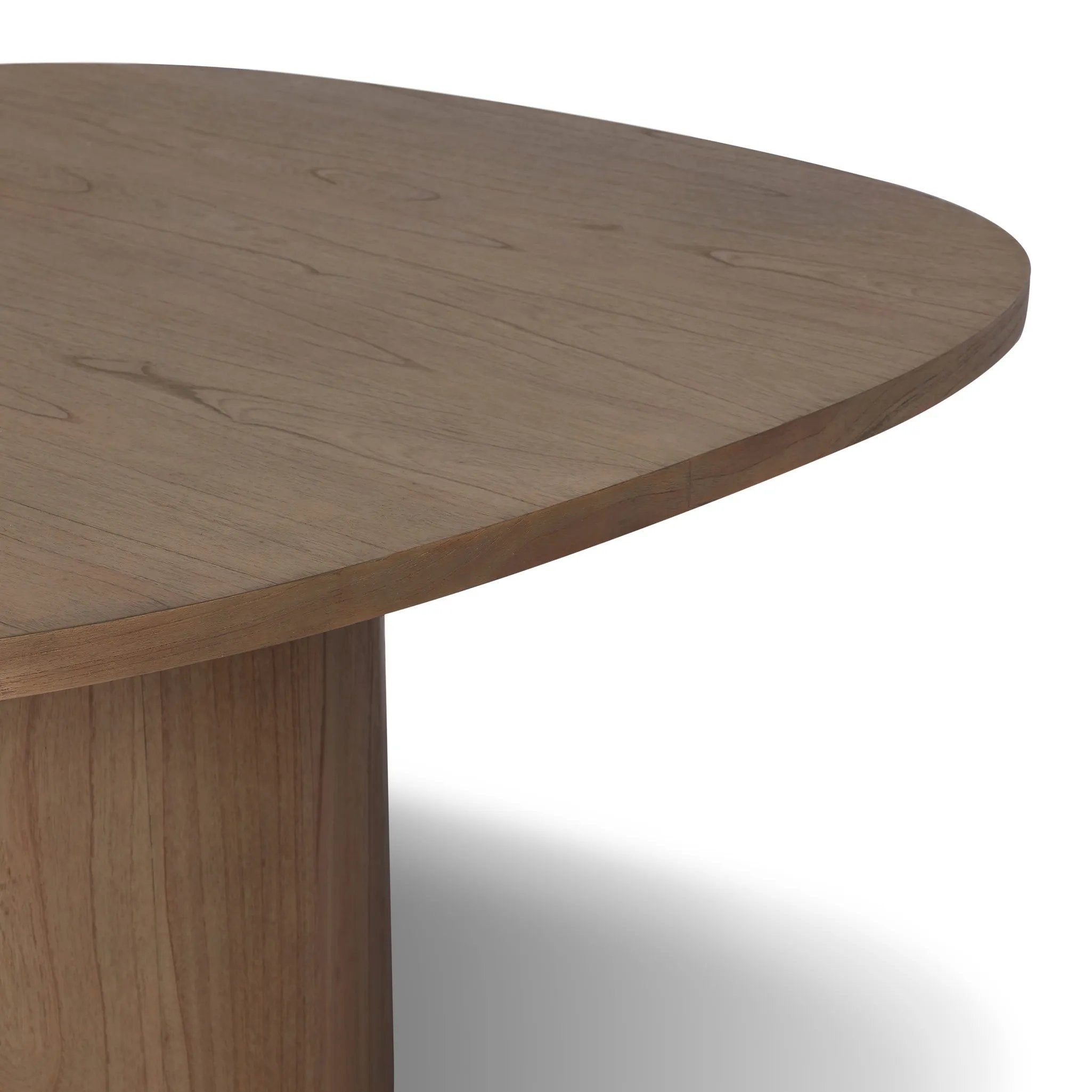 Center your dining space with a beautifully simple style inspired by soft Brutalism. Made from solid mindi with a light, sandy finish, this monolithic piece features a unique "squircle" tabletop, with flowing curves on its edges. A substantial plinth base is rotated to a 45-degree angle to highlight this piece's playful shaping Amethyst Home provides interior design, new home construction design consulting, vintage area rugs, and lighting in the Nashville metro area.
