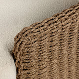This outdoor chair's sculpted shape mimics classic wingback armchairs, with a double-twist woven material framing heavily textured boucle fabric for added visual weight. Cover or store inside during inclement weather or when not in use. Amethyst Home provides interior design, new home construction design consulting, vintage area rugs, and lighting in the Boston metro area.