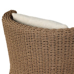 This outdoor chair's sculpted shape mimics classic wingback armchairs, with a double-twist woven material framing heavily textured boucle fabric for added visual weight. Cover or store inside during inclement weather or when not in use. Amethyst Home provides interior design, new home construction design consulting, vintage area rugs, and lighting in the Houston metro area.