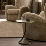 Featuring Vera Hammered Aged Brass End Table by Four Hands at Amethyst Home. A low-profile end table features a snake-like base finished in a hammered aged brass. Perfectly sized to keep your favorite drink or book within reach, to make your evening ritual a little smoother. Overall Dimensions: 16.00"w x 16.00"d x 18.75"h. Amethyst Home provides interior design, new home construction design consulting, vintage area rugs, and lighting in the Calabasas metro area.