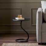 Featuring Vera Hammered Gunmetal End Table by Four Hands at Amethyst Home. A low-profile end table features a snake-like base finished in a hammered gunmetal. Perfectly sized to keep your favorite drink or book within reach, to make your evening ritual a little smoother. Overall Dimensions: 16.00"w x 16.00"d x 18.75"h. Amethyst Home provides interior design, new home construction design consulting, vintage area rugs, and lighting in the Dallas metro area.