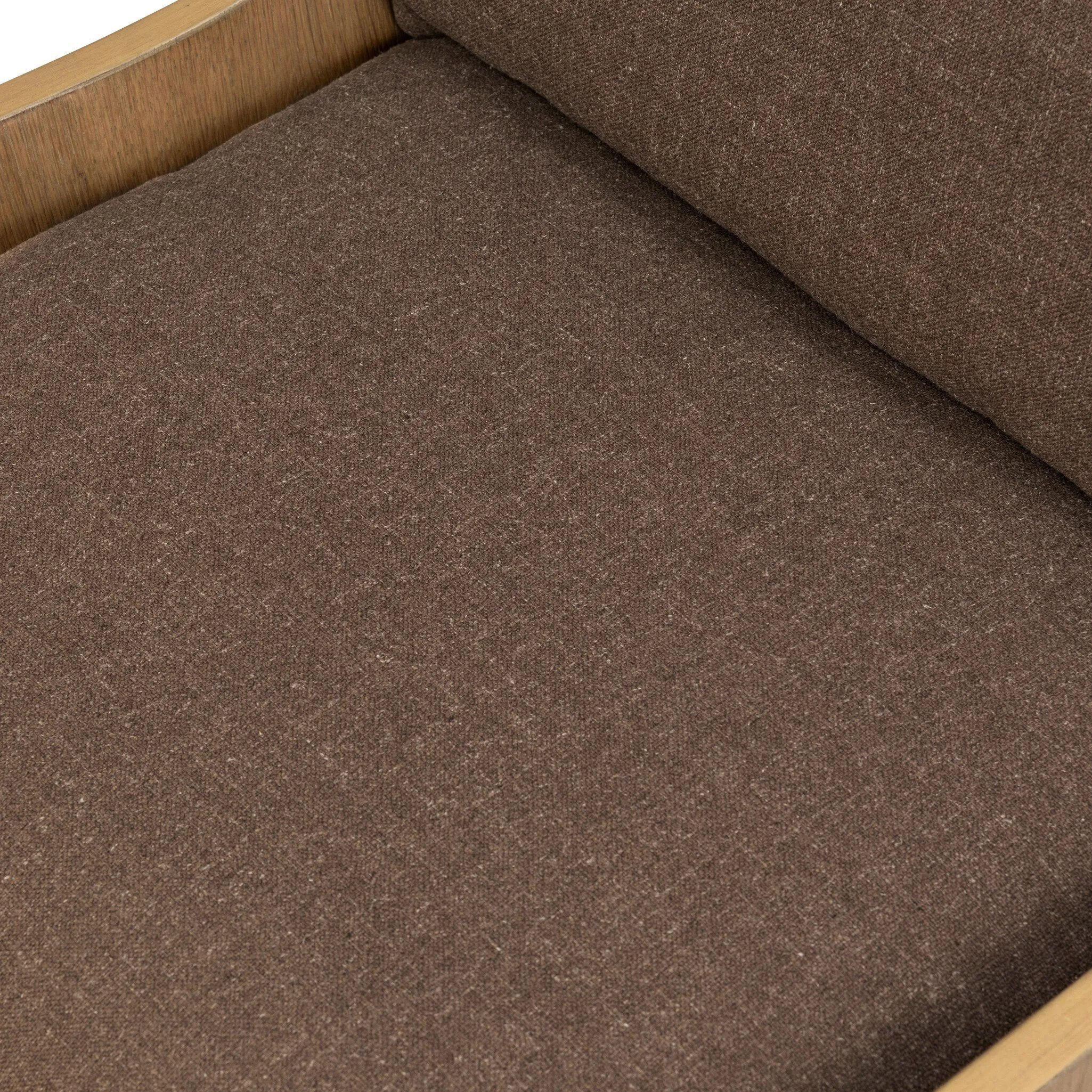 A timeless silhouette reimagined in a new way. Wrapped in high performance fabric, this wingback chair offers a rich, coffee-brown depth highlighted by delicate, linen flecks with natural highs and lows. Woven back and aged oak add beautiful character.As fans of organic modern design at Amethyst, we love the warm modern inspired Vestavia Chair. Amethyst Home provides interior design, new home construction design consulting, vintage area rugs, and lighting in the Kansas City metro area.